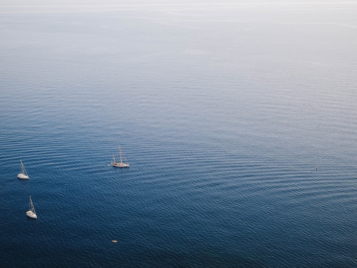 Sailboats on the sea with gentle waves