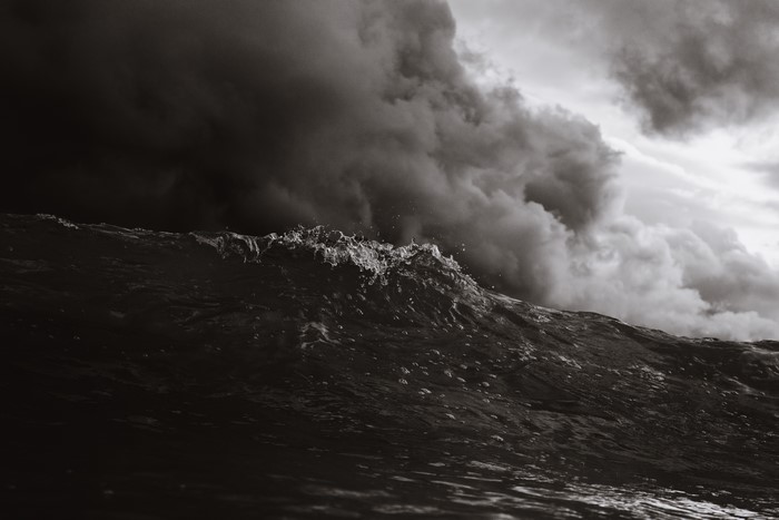 Monochrome wave under stormy clouds