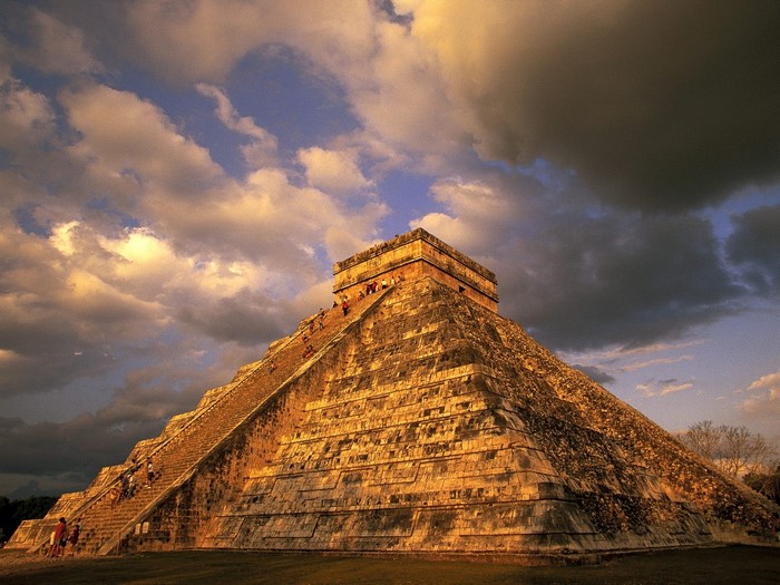 El Castillo pyramid at Chichen Itza under cloudy sky