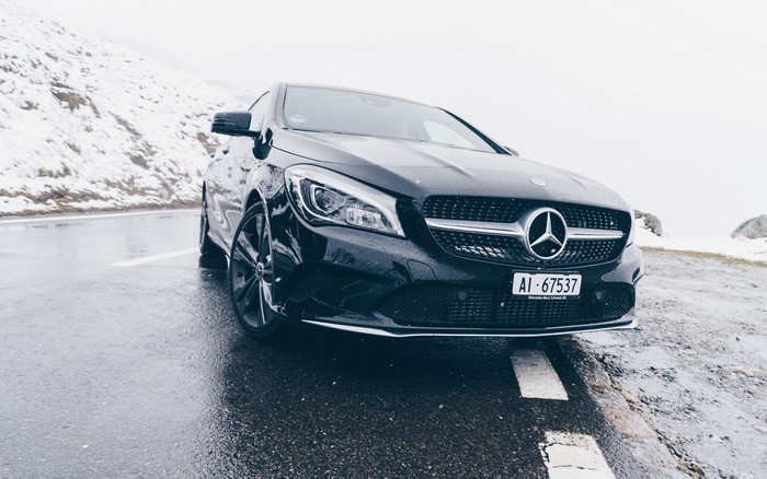 4K Mercedes Benz car on a wet road with snow