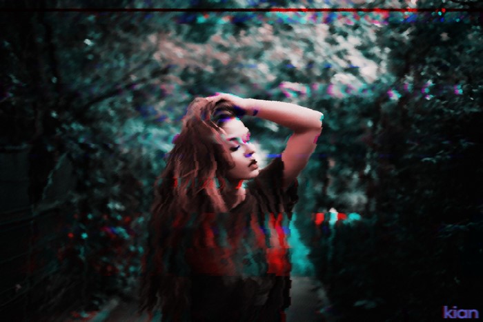 Woman with hand in hair, glitch art effects