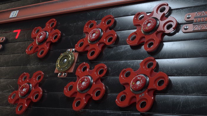 Red Fidget Spinners on a Textured Wall
