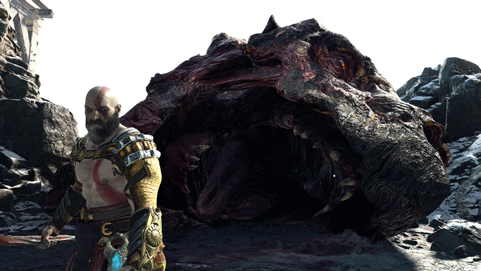 Kratos from God of War facing a large creature