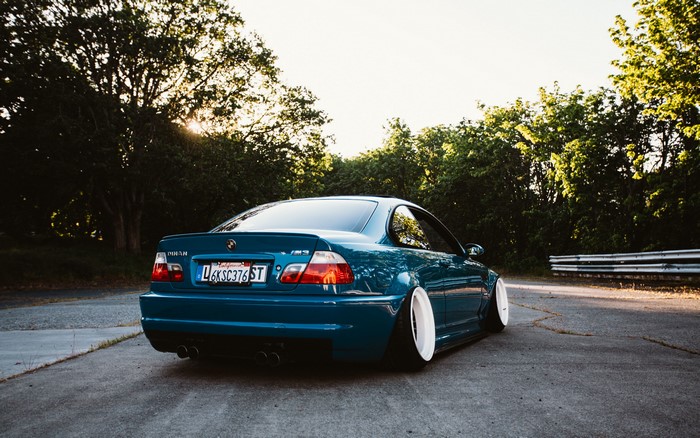 Blue BMW E46 M3 with white wheels