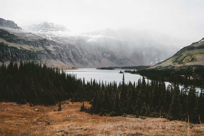 4K mountain landscape with lake and pine trees