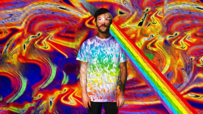 Man in tie-dye shirt against psychedelic background