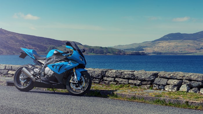 Blue BMW S 1000 RR motorcycle by a lake