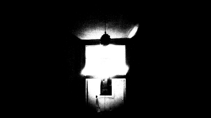 Monochrome room with a hanging light fixture