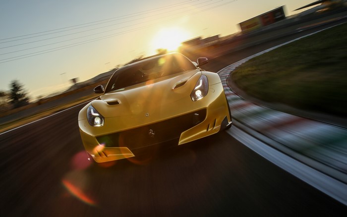 Yellow Ferrari F12 on a Racetrack