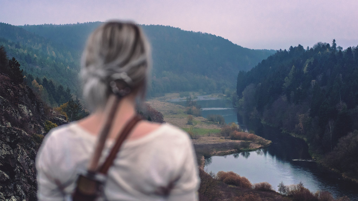 Ciri from The Witcher looking at a river valley