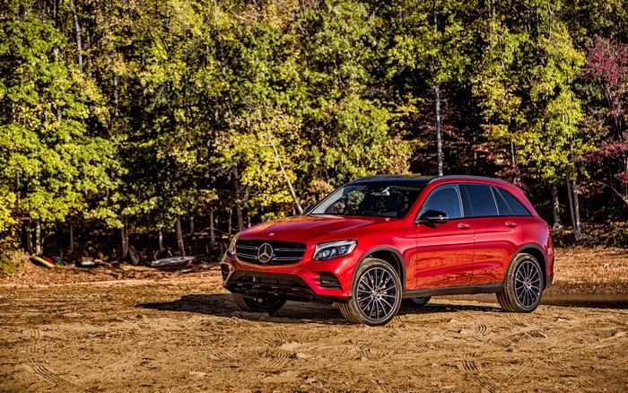 Red Mercedes Benz GLC SUV parked on dirt
