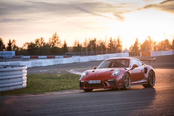 Red Porsche 911 GT3 RS on a Race Track