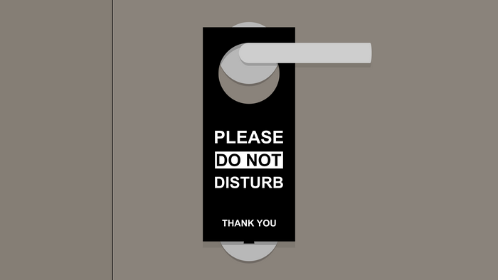 Do Not Disturb sign on a door handle