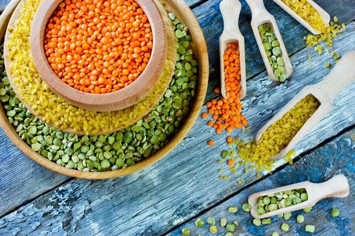 Assortment of Lentils and Grains on Wooden Surface