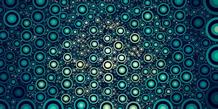 Abstract pattern of concentric circles in shades of teal and green