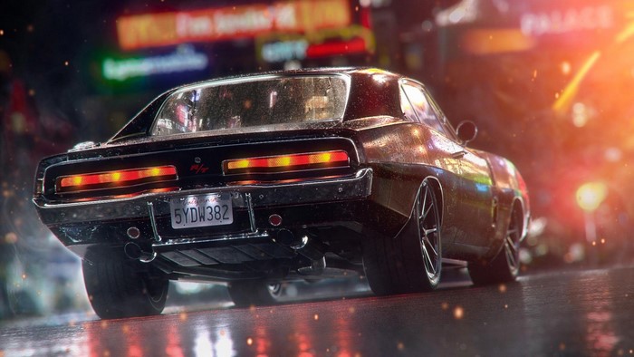 Black Dodge Charger on a wet street at night