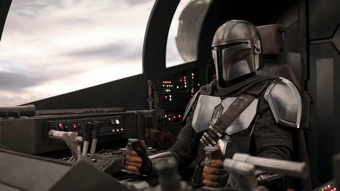 The Mandalorian in his ship cockpit