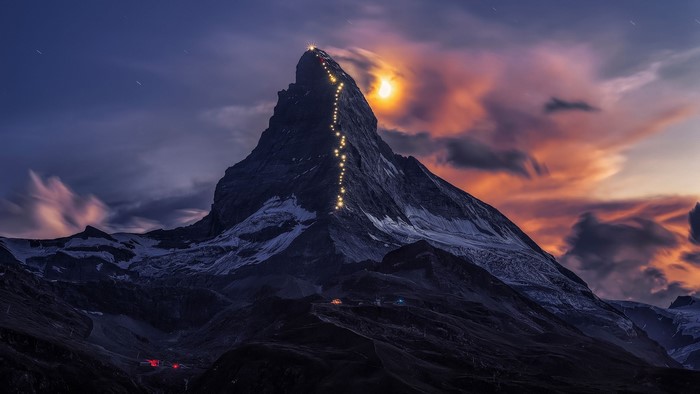 Matterhorn mountain with lights at dusk