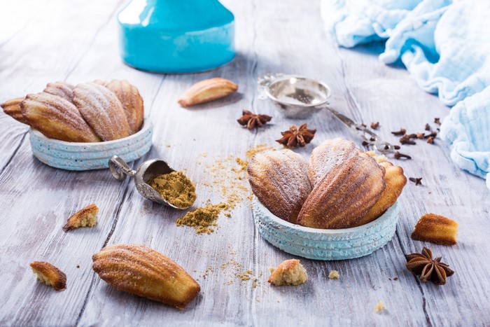 Madeleines with powdered sugar and spices