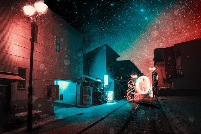 Night street in Japan with red and blue lighting