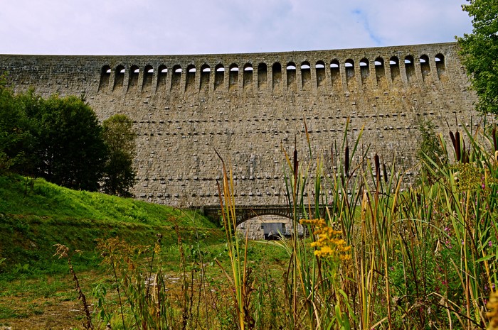 Stone dam with arched windows and reeds in Germany