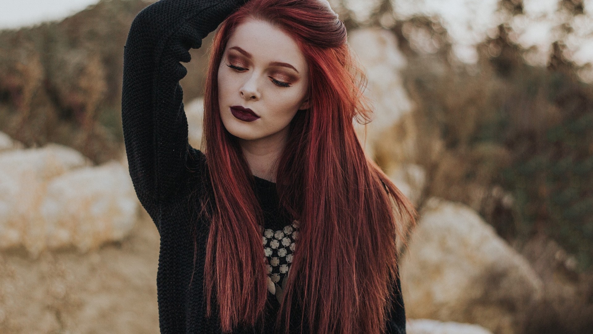 Redhead woman with long hair and dark lipstick outdoors HD Wallpaper