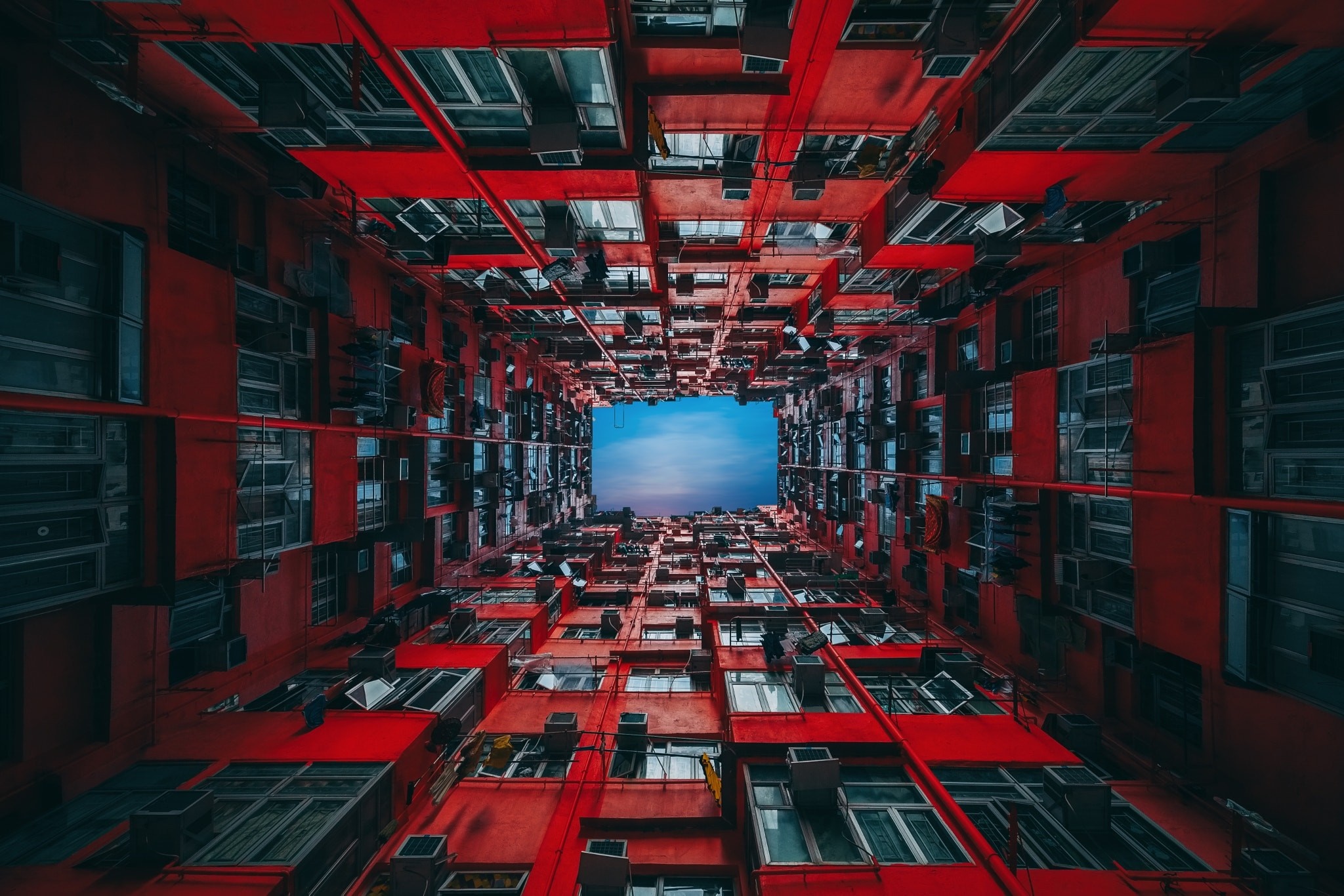 Apartment building courtyard looking up at the sky HD Wallpaper