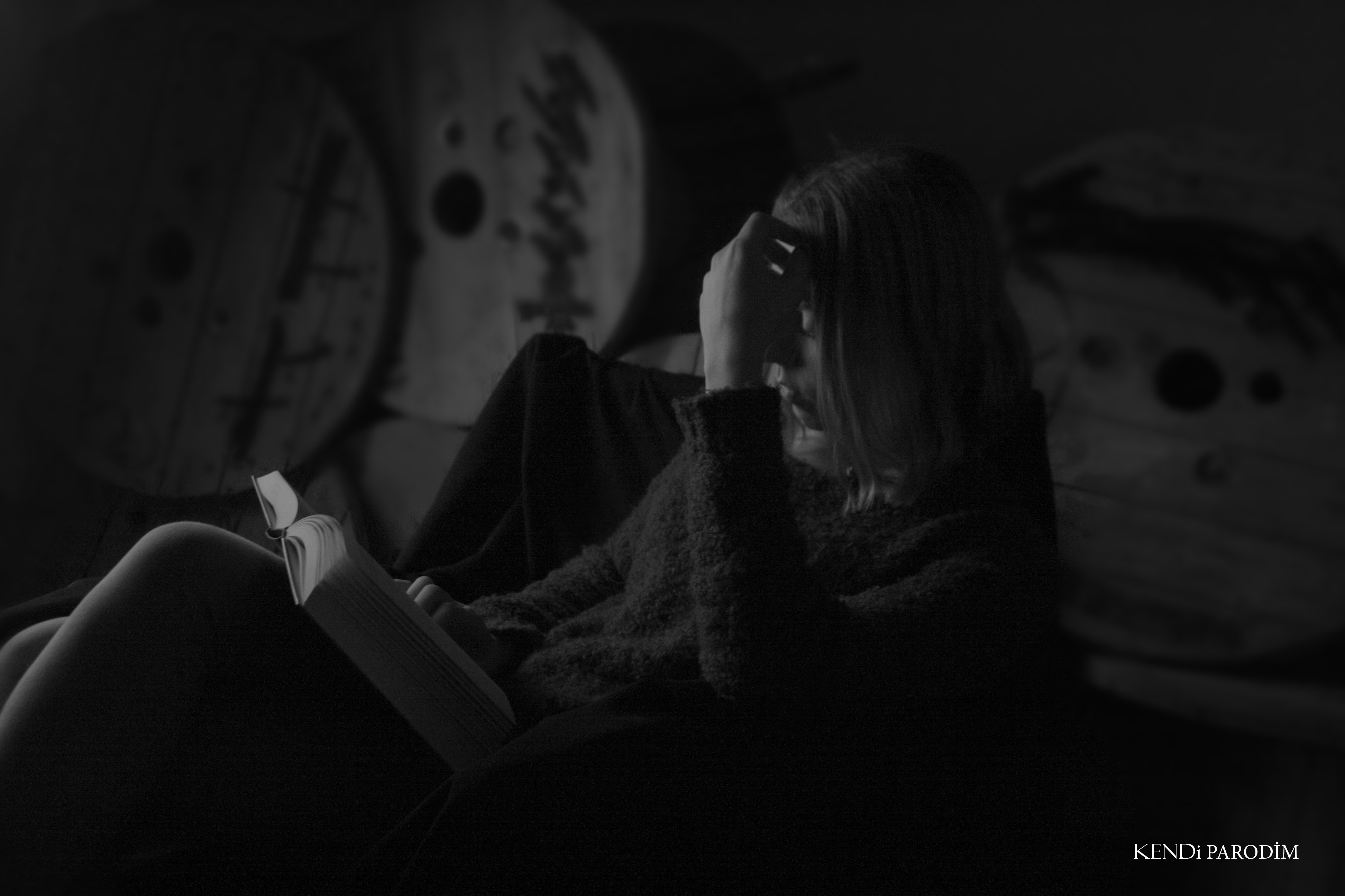 Woman reading a book in dim light HD Wallpaper
