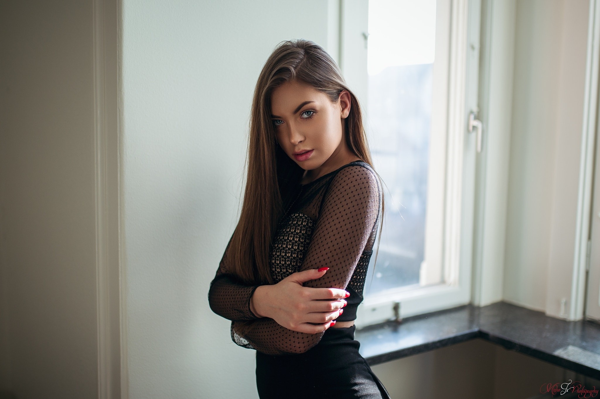 Woman in black clothing posing by window HD Wallpaper
