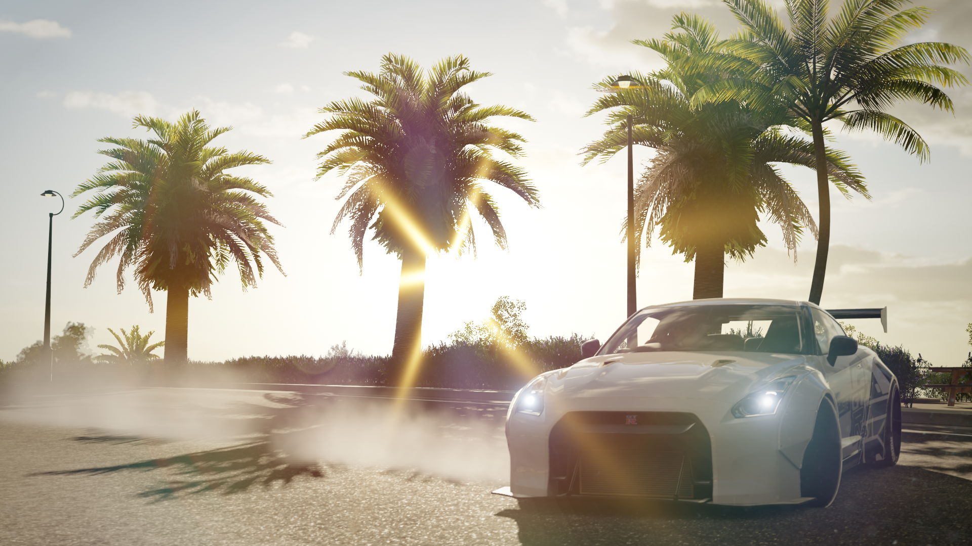 White Nissan GT-R drifting with palm trees at sunset HD Wallpaper