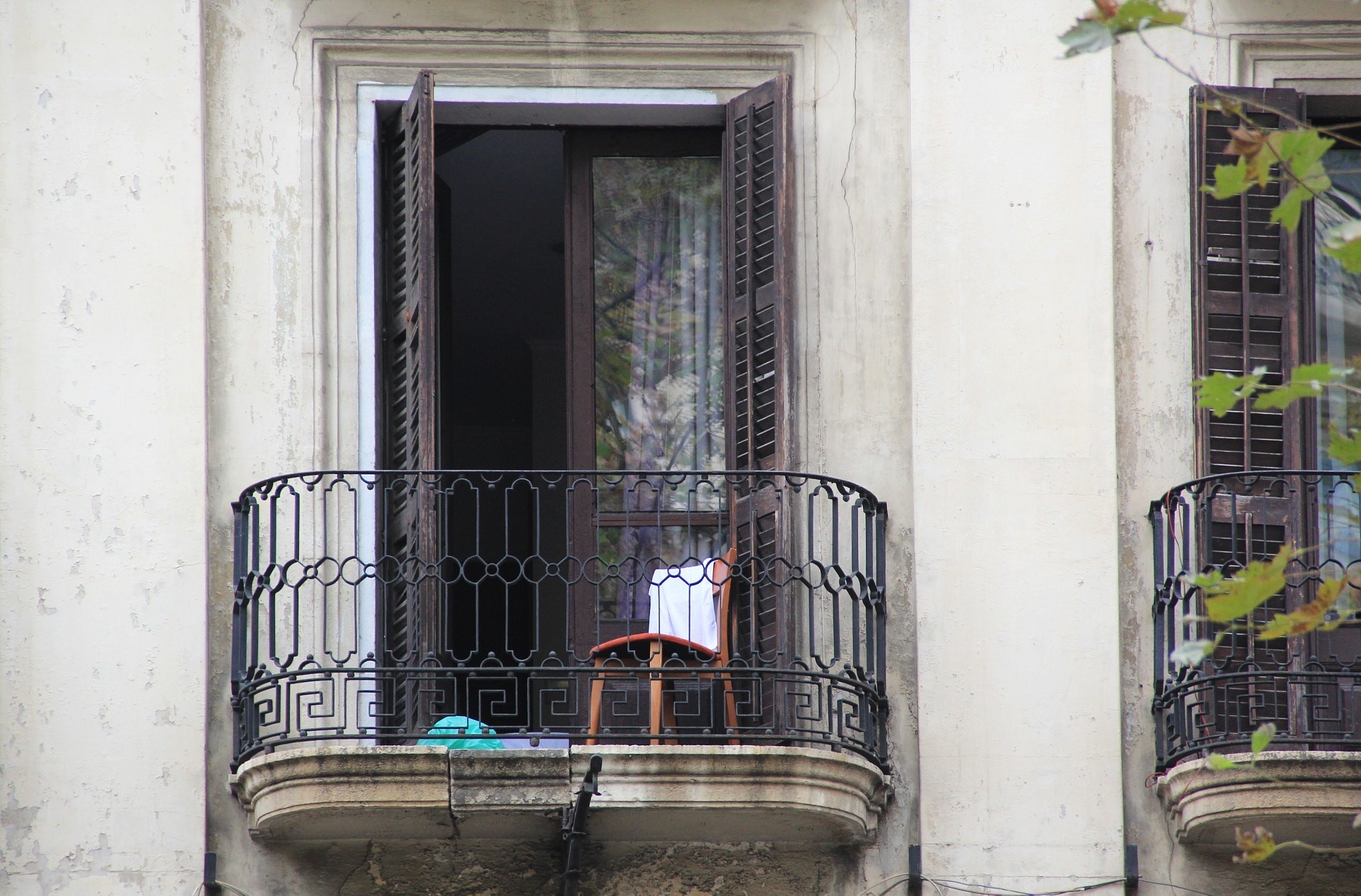 Balcony with open shutters and chair HD Wallpaper