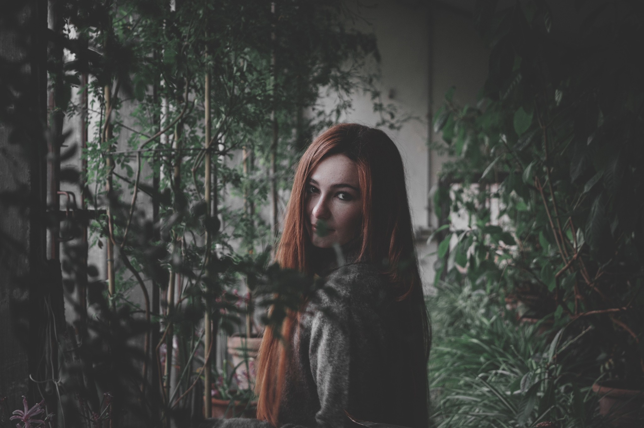 Woman with red hair in a garden HD Wallpaper