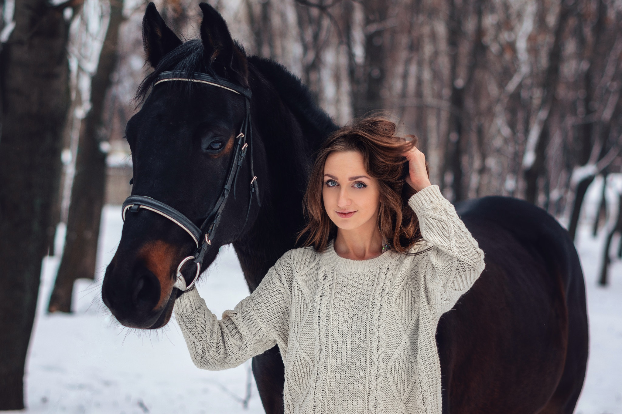 Woman in sweater with horse in winter forest HD Wallpaper