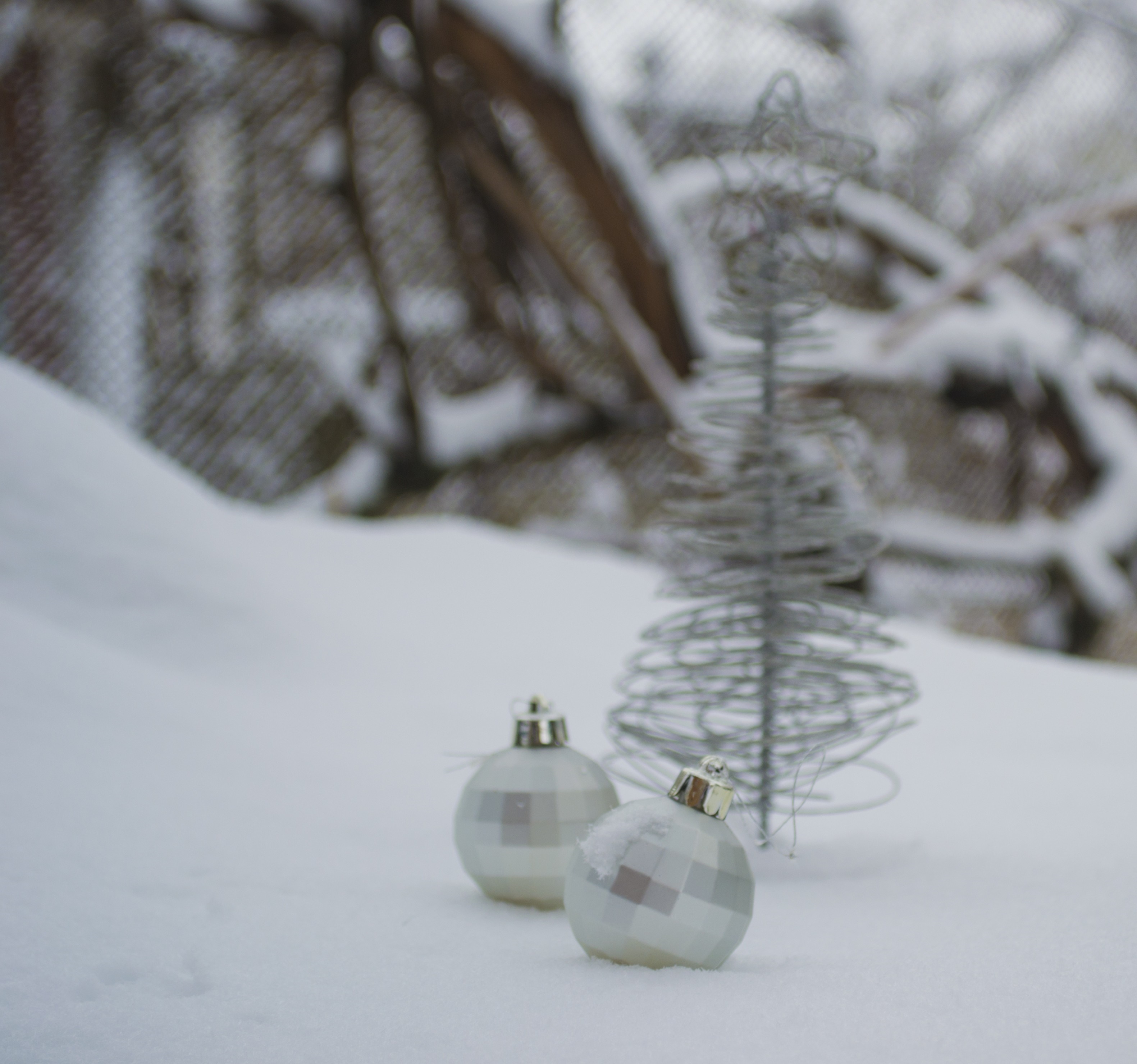 Christmas ornaments and tree in the snow HD Wallpaper