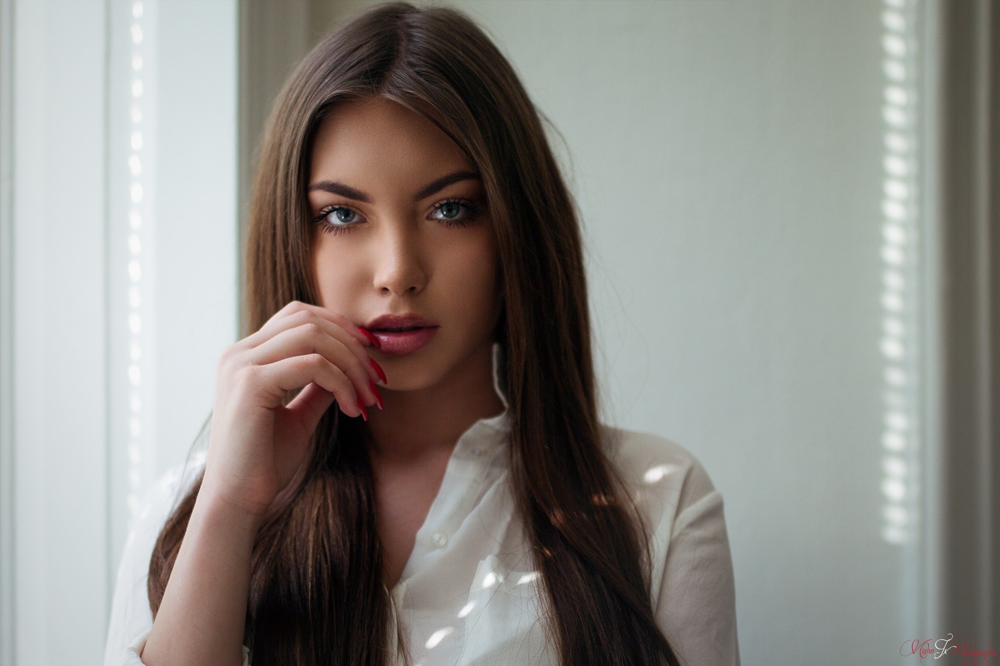 Portrait of a Woman with Long Brown Hair and Red Nails HD Wallpaper