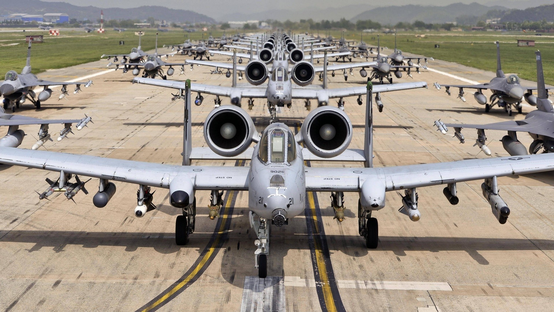 A-10 Thunderbolt II and F-16 Fighting Falcon aircraft on runway HD Wallpaper