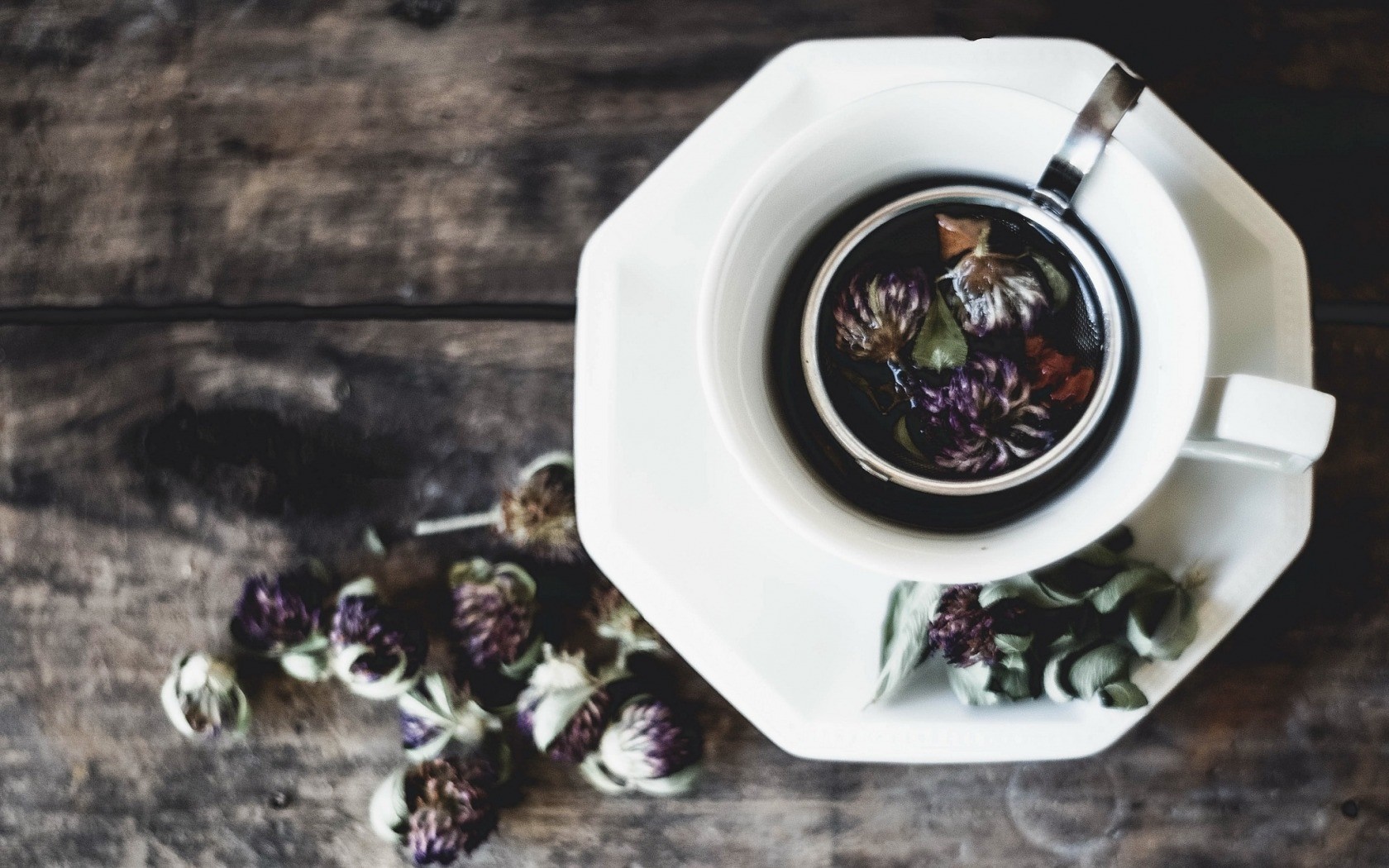Herbal tea with clover flowers on a wooden table HD Wallpaper