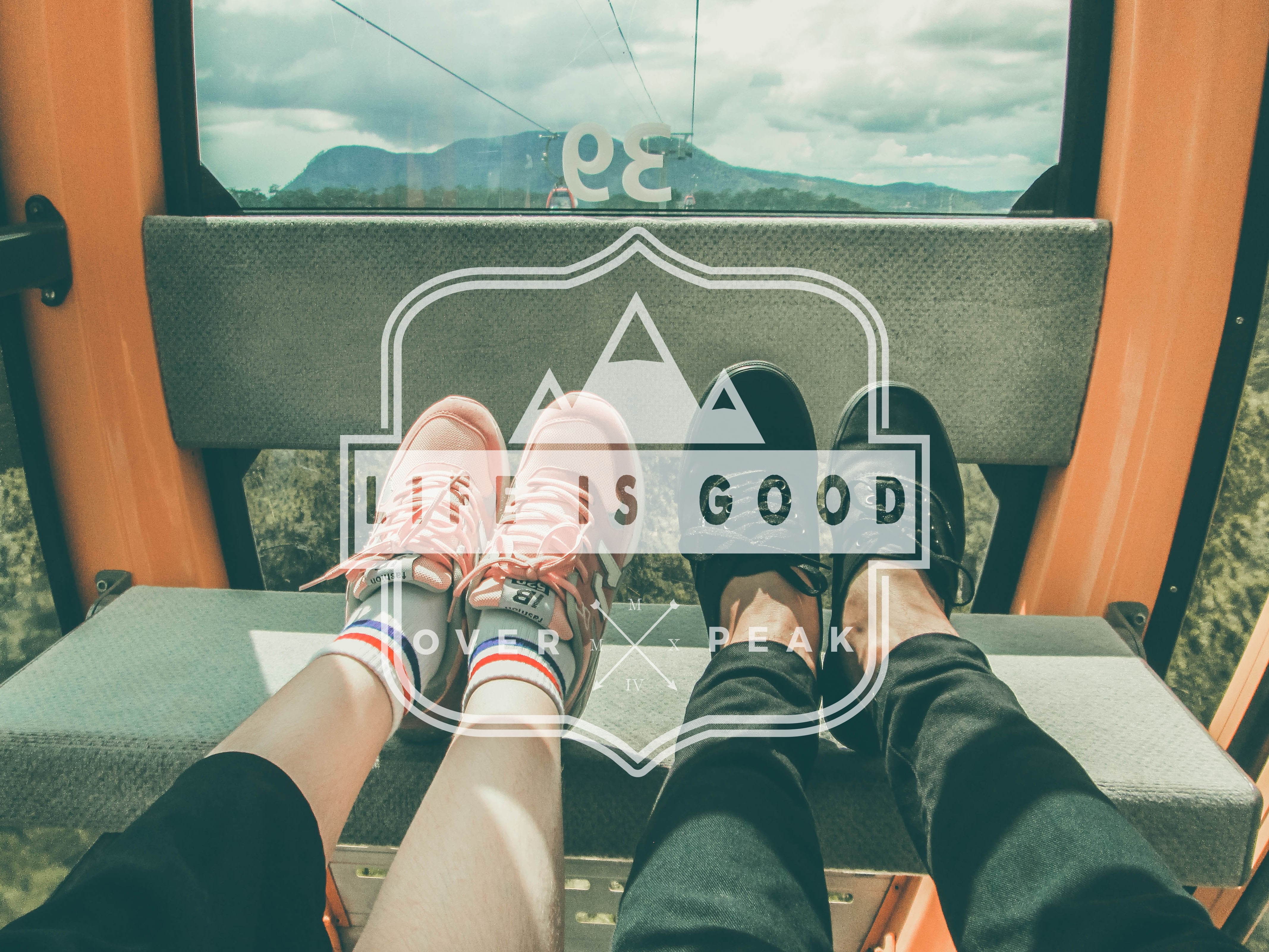 Couple in cable car with mountains view HD Wallpaper