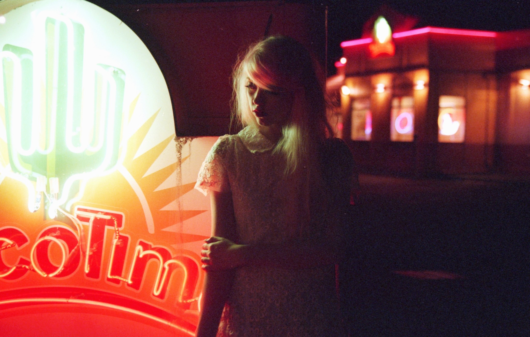 Woman in white dress by Taco Time neon sign at night HD Wallpaper