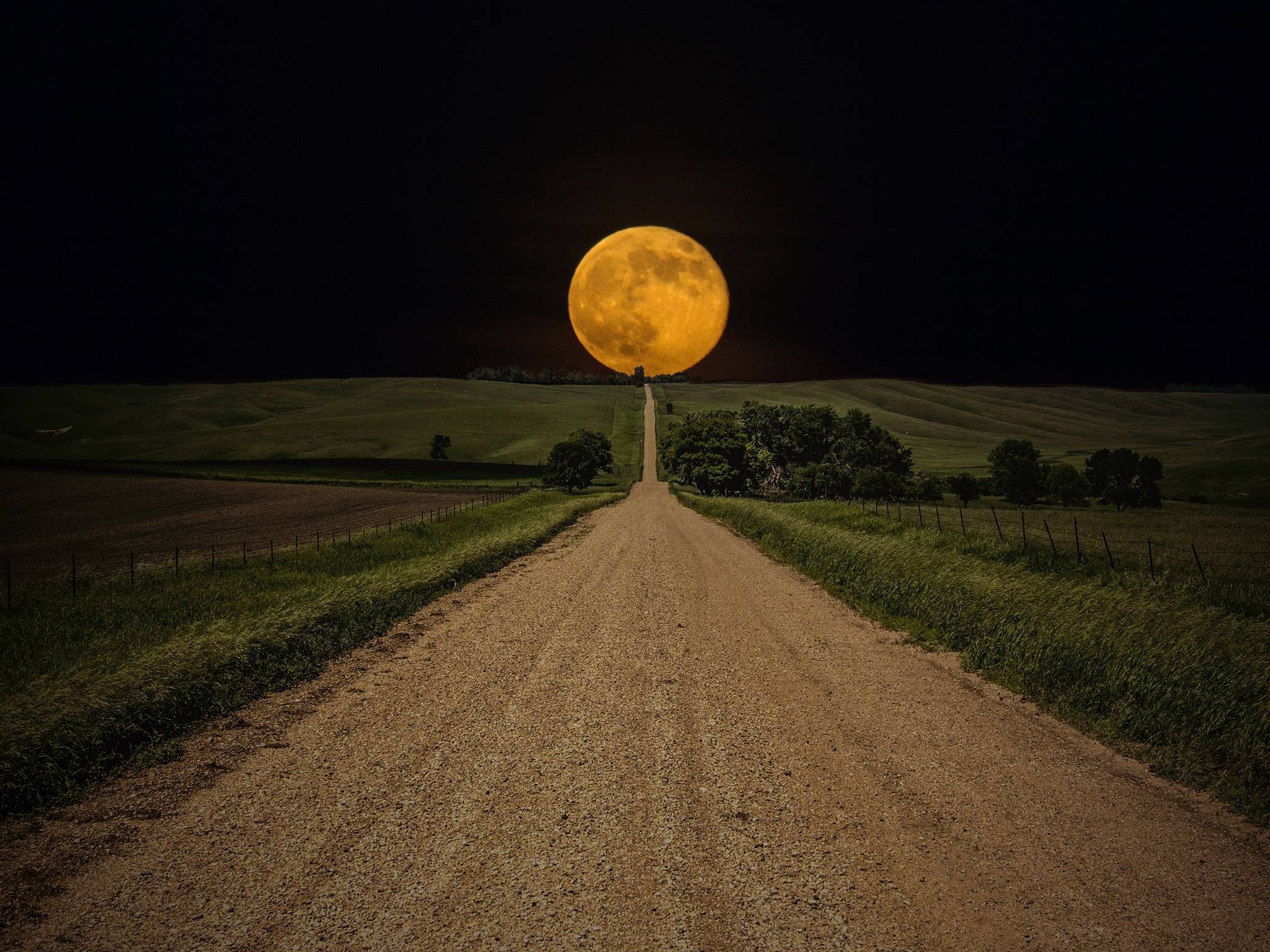 Full moon over a dirt road in a rural landscape HD Wallpaper