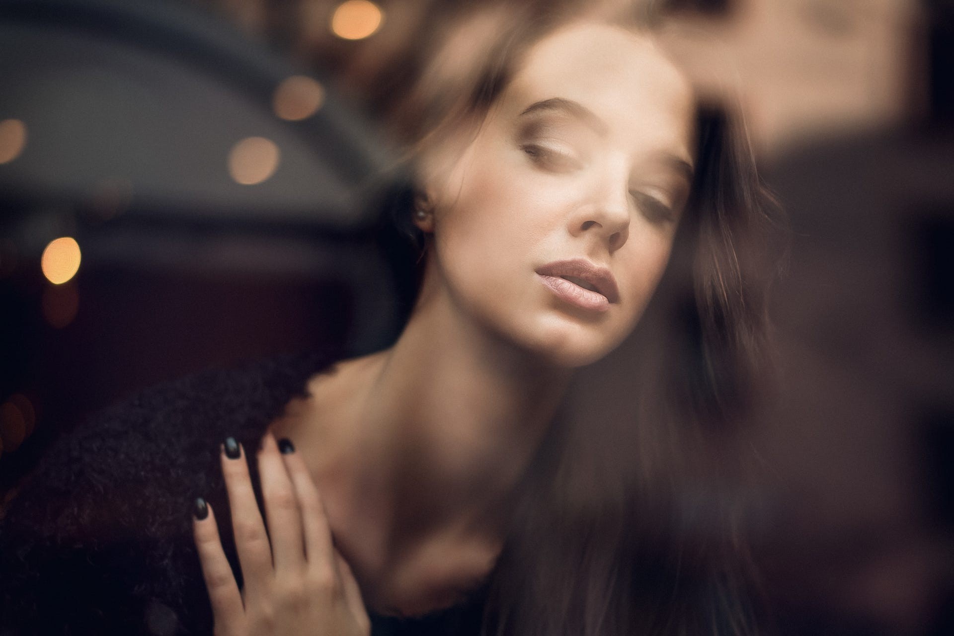 Portrait of a woman with eyes closed HD Wallpaper