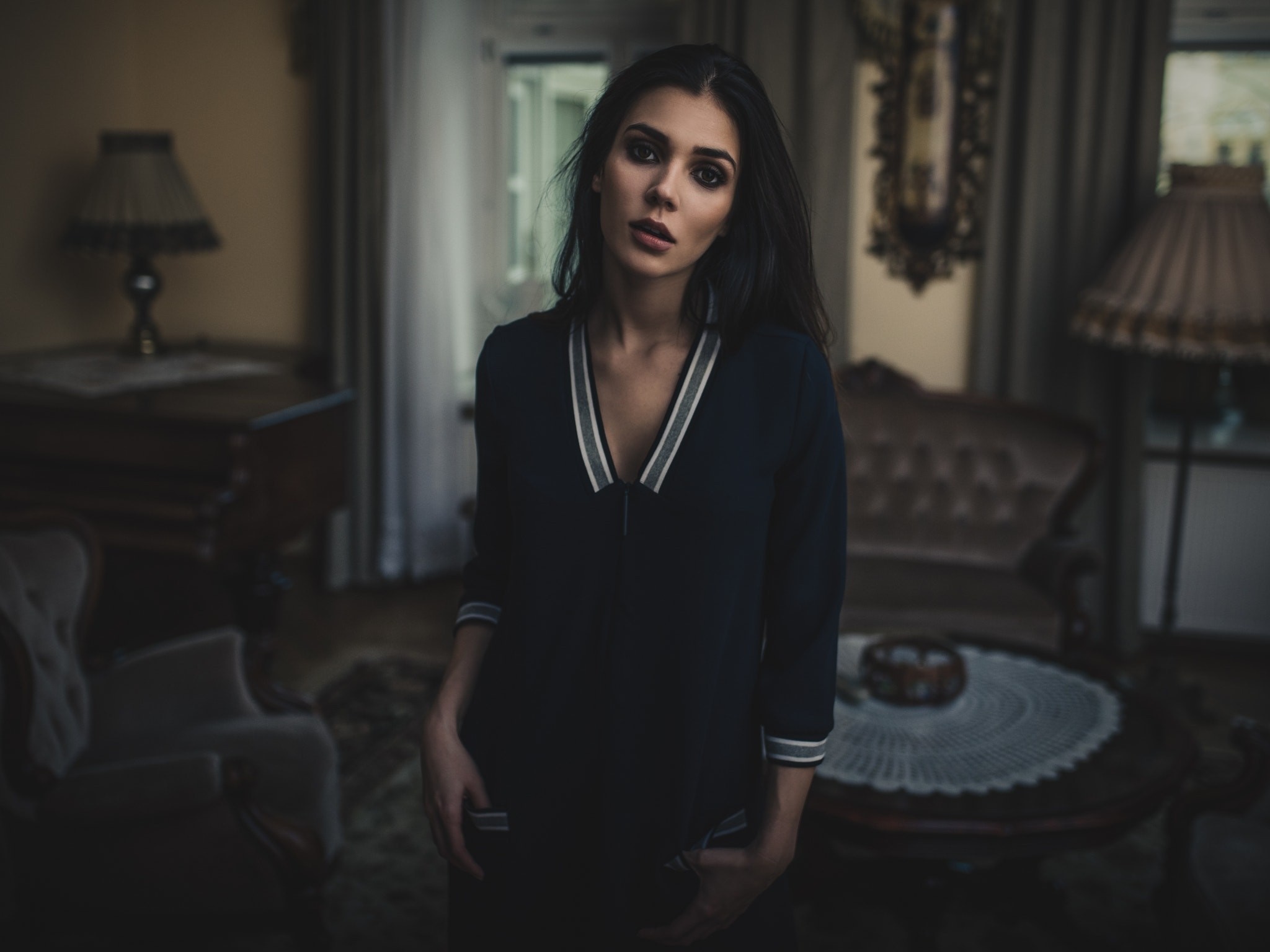Woman in dark dress in vintage room HD Wallpaper