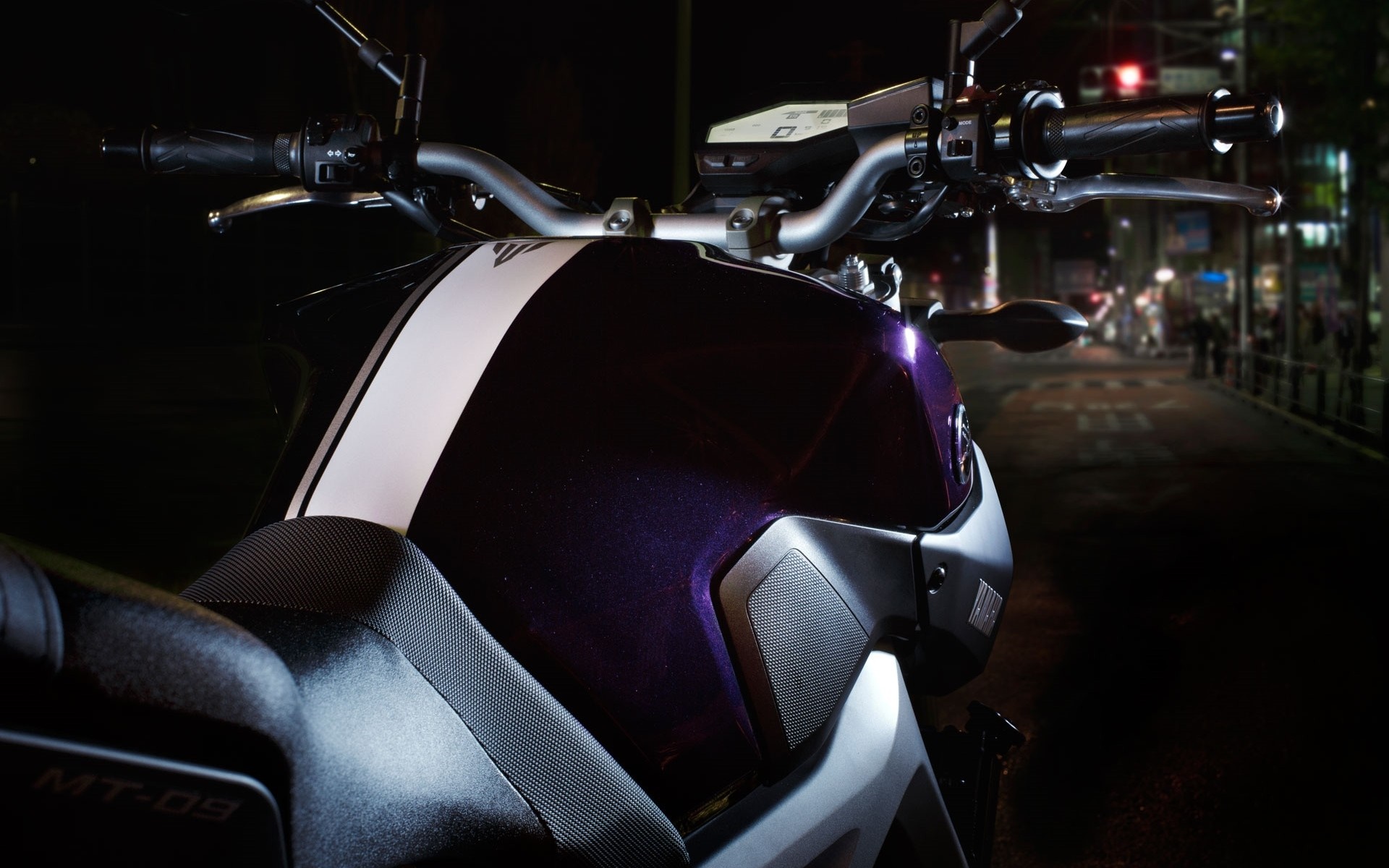 Yamaha MT-09 motorcycle handlebars and fuel tank at night HD Wallpaper