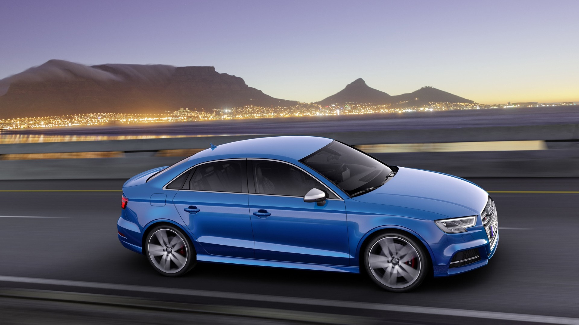 Blue Audi S3 Sedan driving on a road at dusk HD Wallpaper