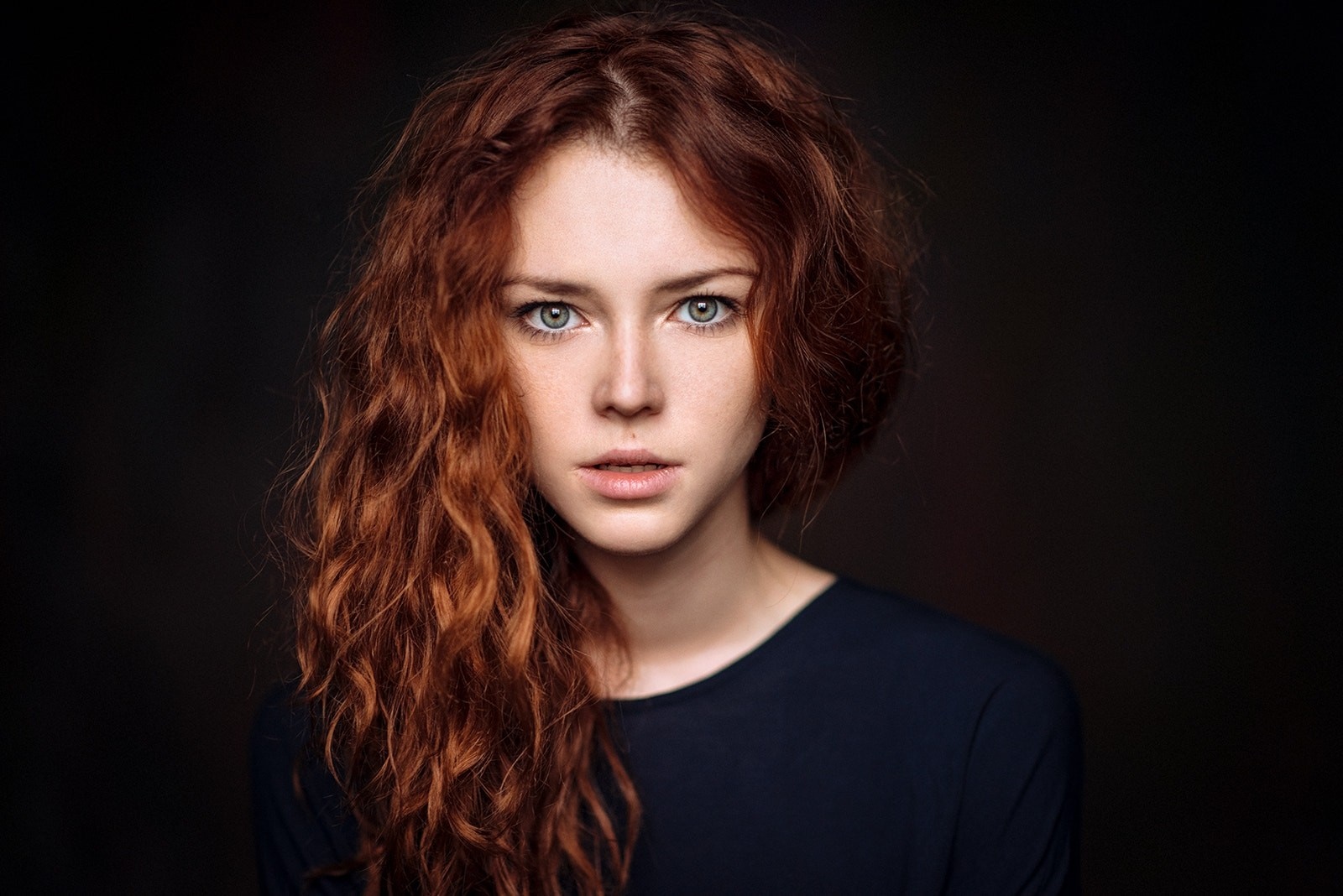 Portrait of a young woman with red wavy hair HD Wallpaper