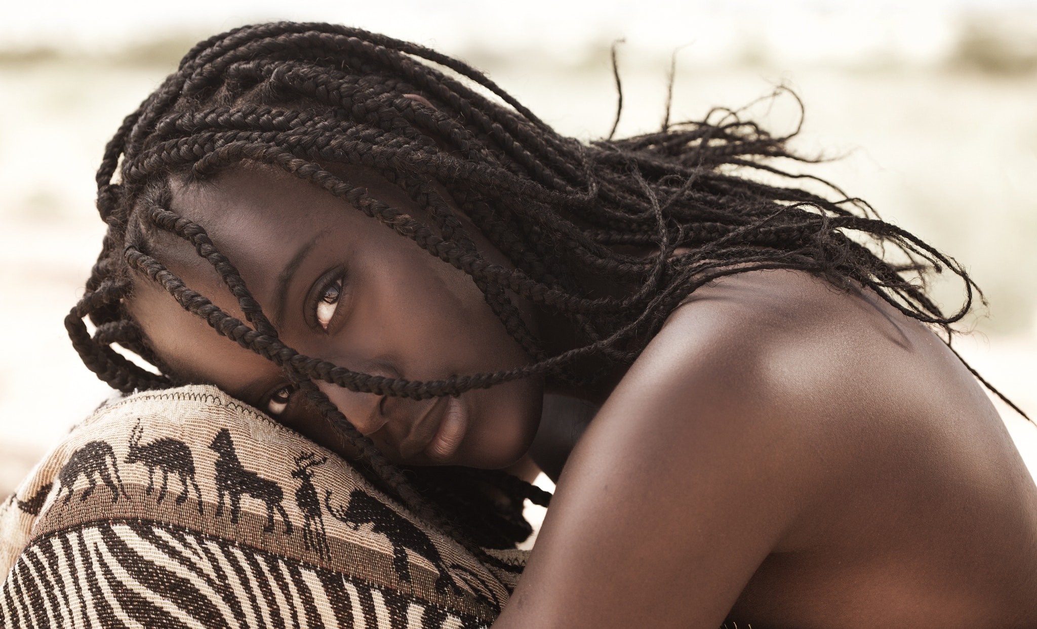Portrait of a woman with braided hair HD Wallpaper