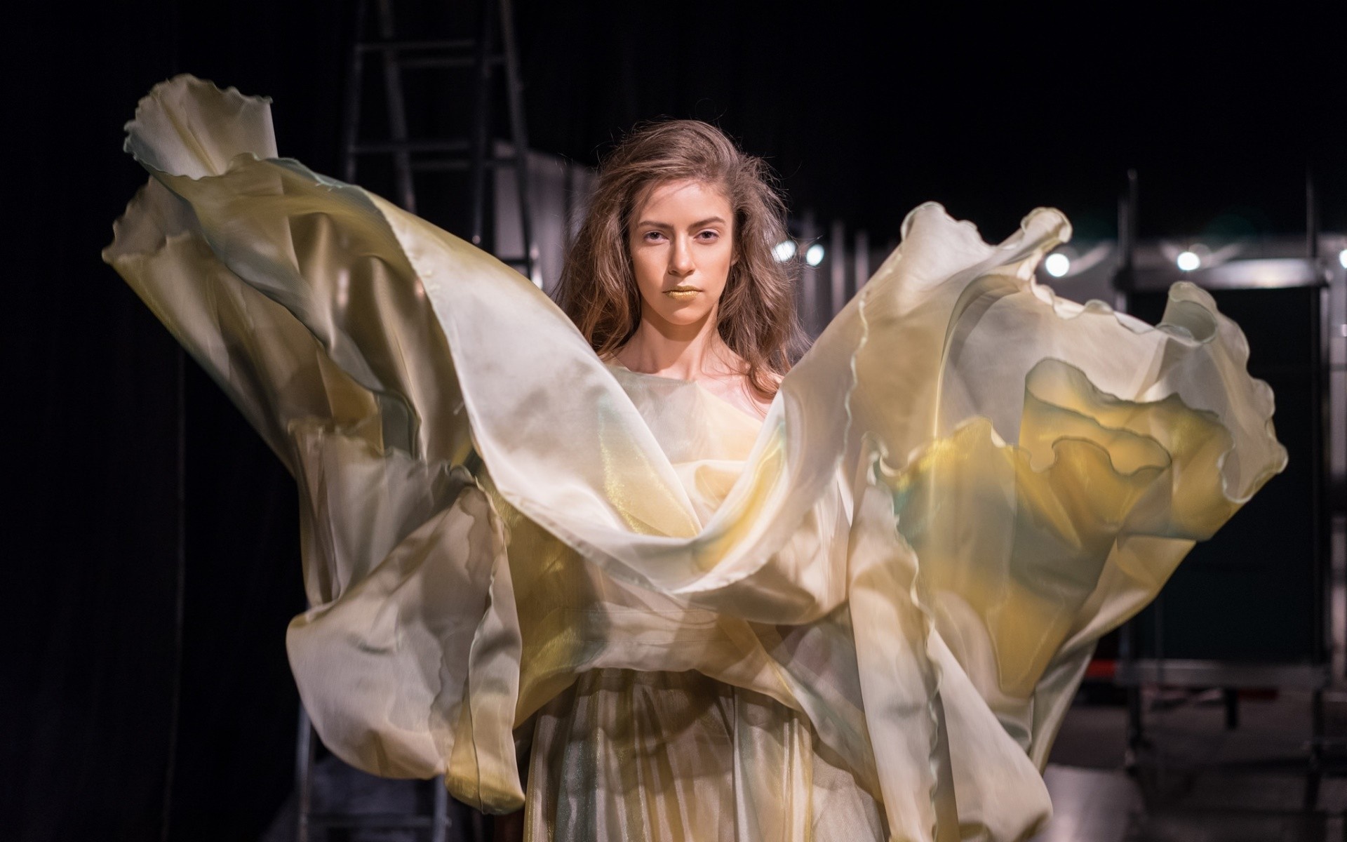 Woman in flowing dress on stage HD Wallpaper