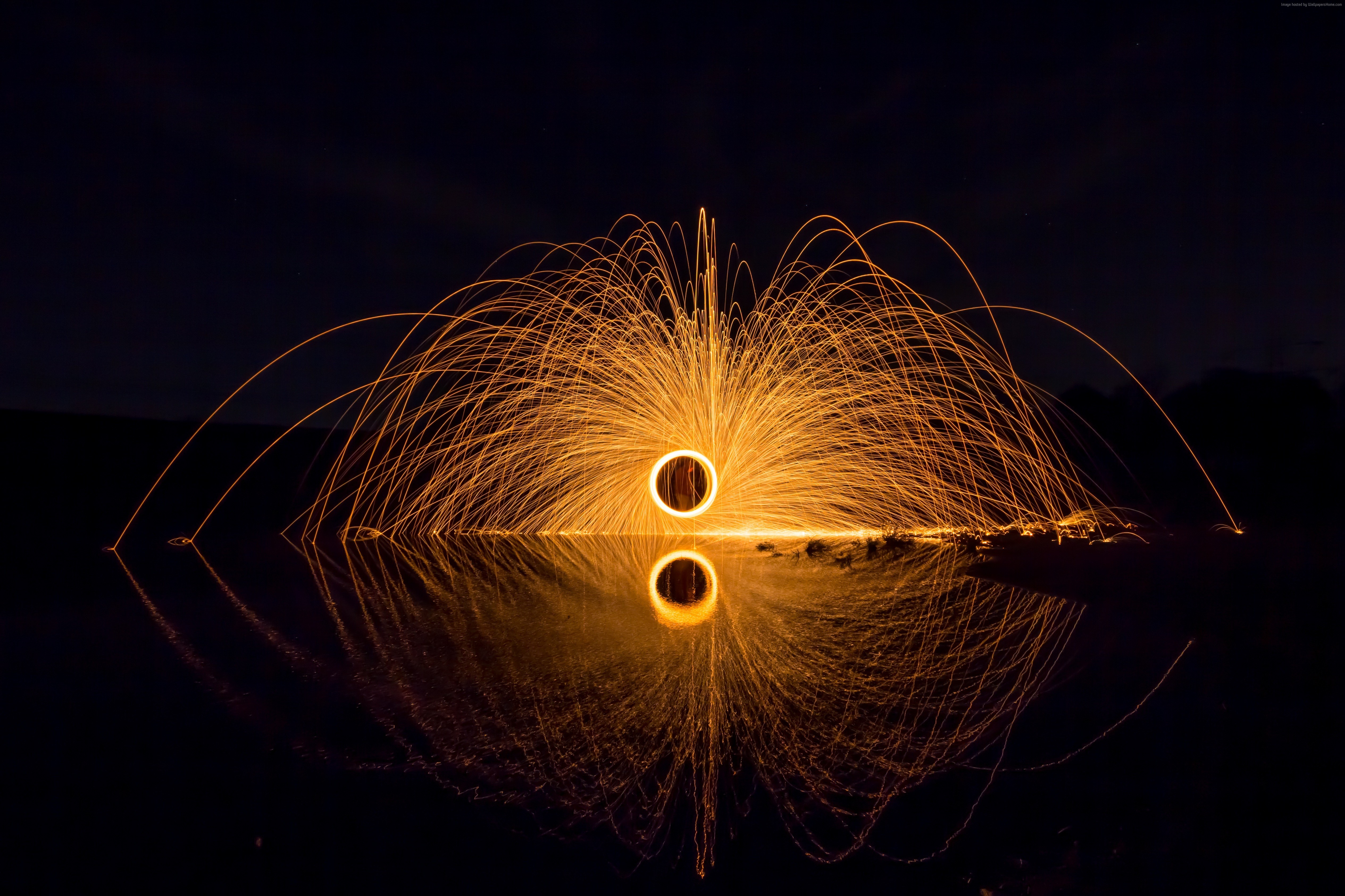 Steel Wool Sparks Reflecting in Water HD Wallpaper