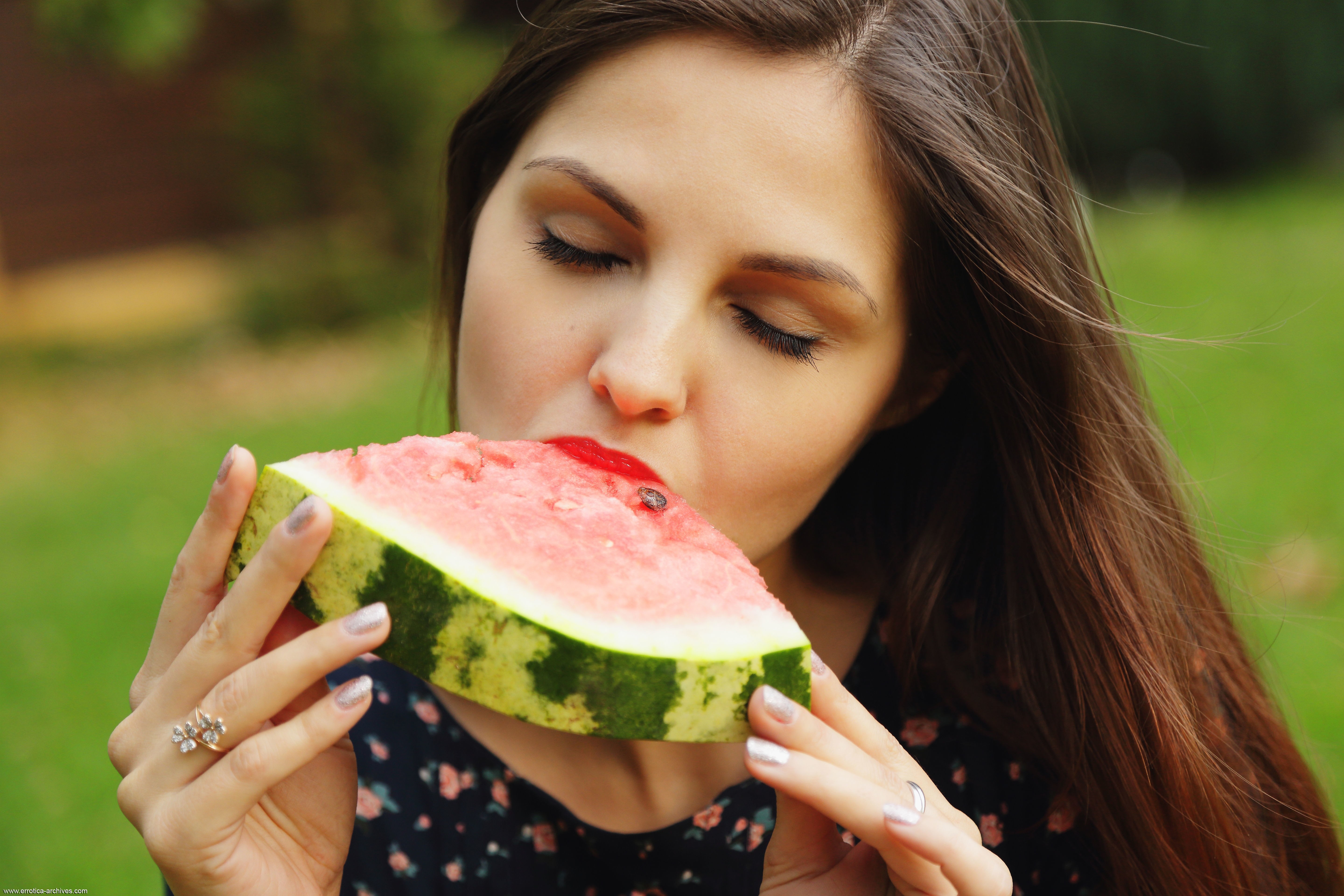 Woman eating a slice of watermelon HD Wallpaper