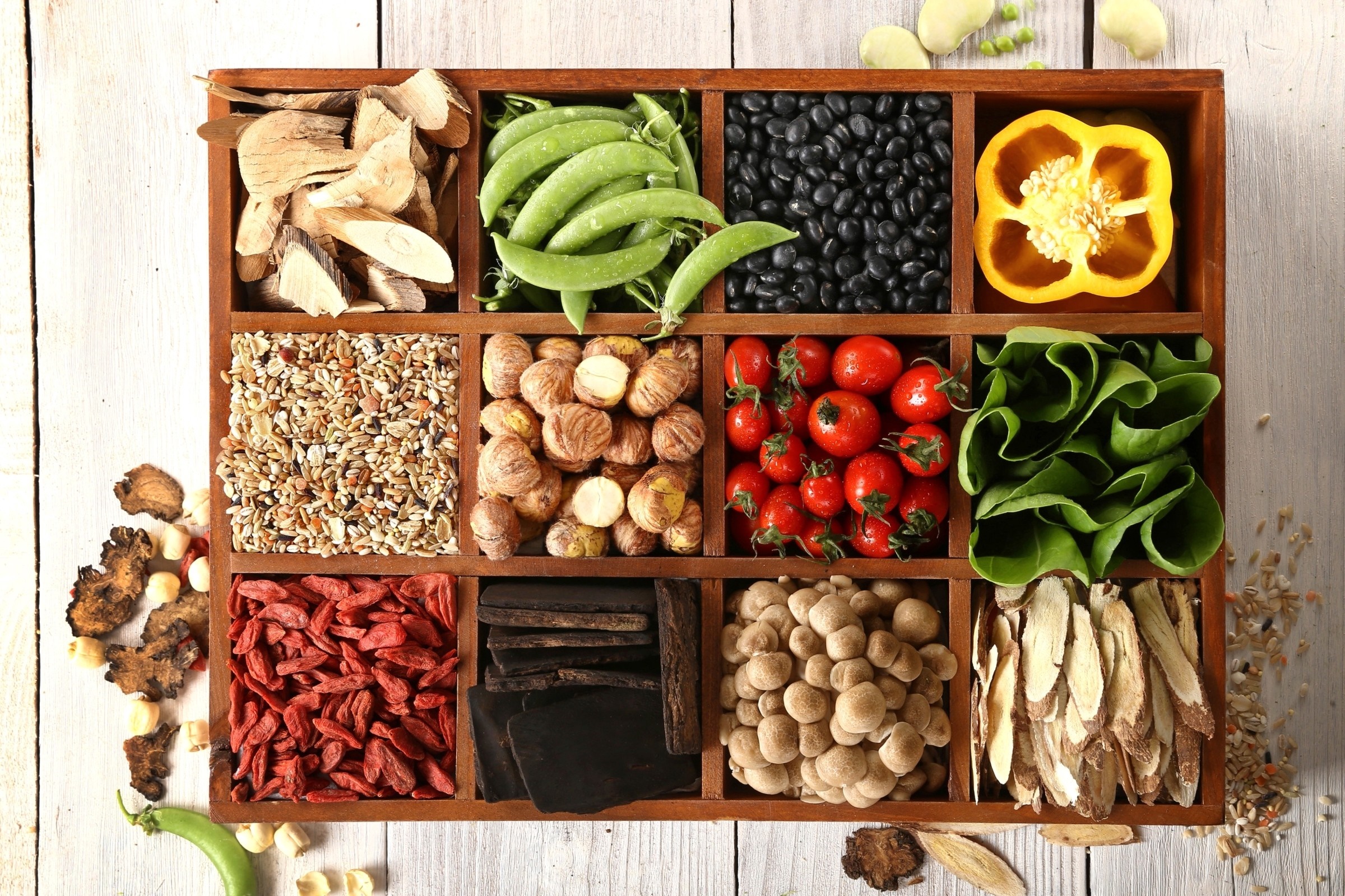 Assortment of dried herbs, beans, vegetables, and grains in a wooden box HD Wallpaper